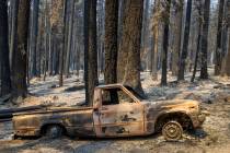 A burned-out pickup truck from the Caldor Fire on Thursday, Sept. 2, 2021, in Twin Bridges, Cal ...