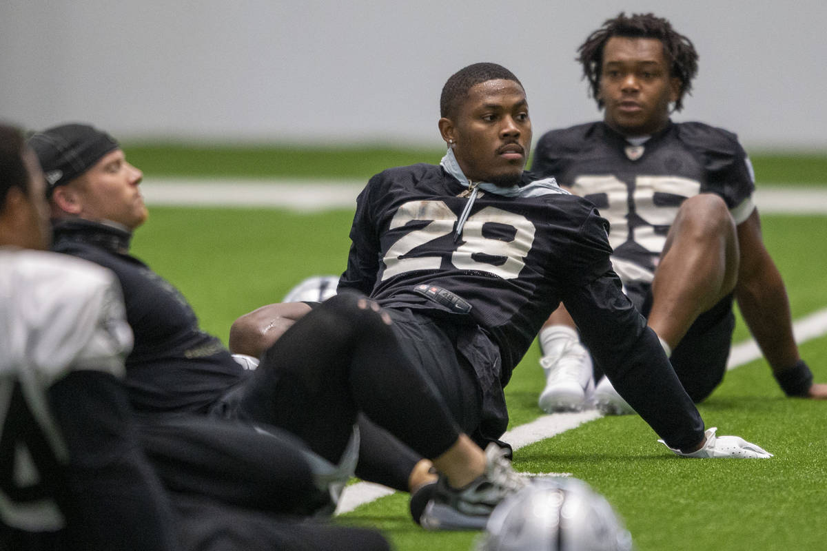 Raiders running back Josh Jacobs (28) stretches during team practice at the Raiders Headquarter ...