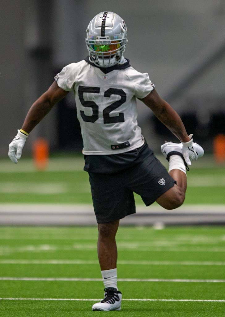 Raiders linebacker Denzel Perryman (52) stretches during team practice at the Raiders Headquart ...