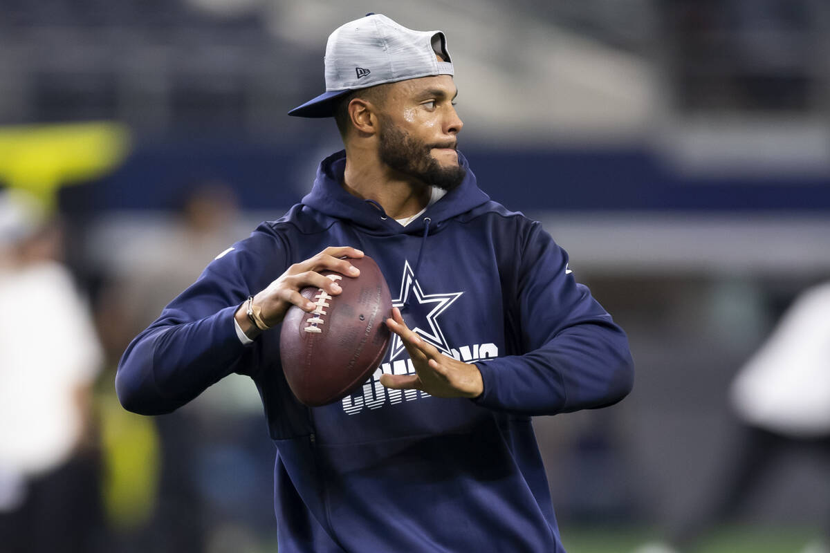 Dallas Cowboys quarterback Dak Prescott participates in warm ups before an NFL preseason footba ...