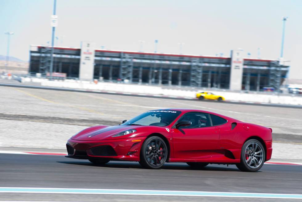 Exotics Racing Co-Owner, Romain Thievin, drives a Ferrari 458 Scuderia around the Exotics Racin ...