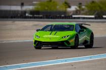 UNLV Head Women's Basketball Coach Lindy La Rocque speeds up the straight away with instructor ...