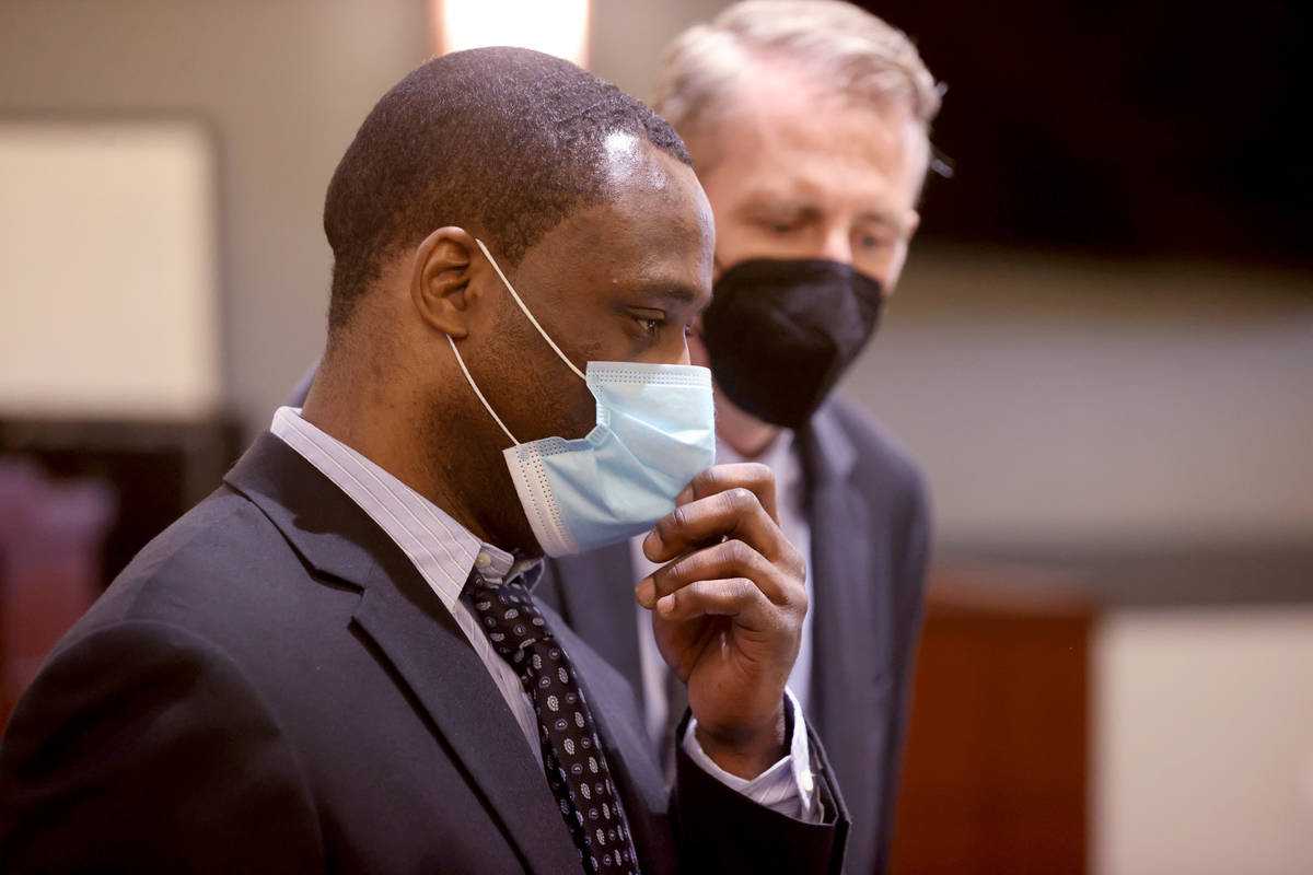 Antonio Bridges, left, who is charged in the death of his girlfriend's 1-year-old son, talks wi ...