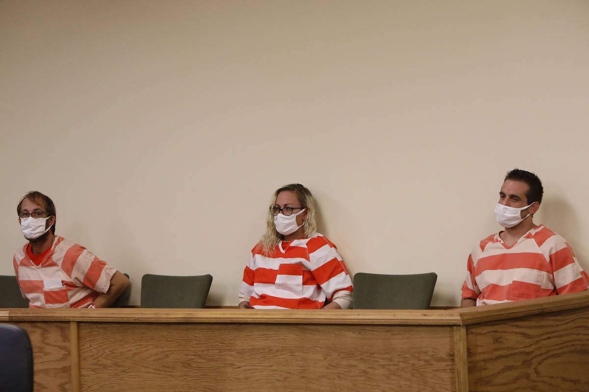 Brad Mehn, from left, Heather Pate and Kevin Dent attend a hearing at Pahrump Justice Court on ...