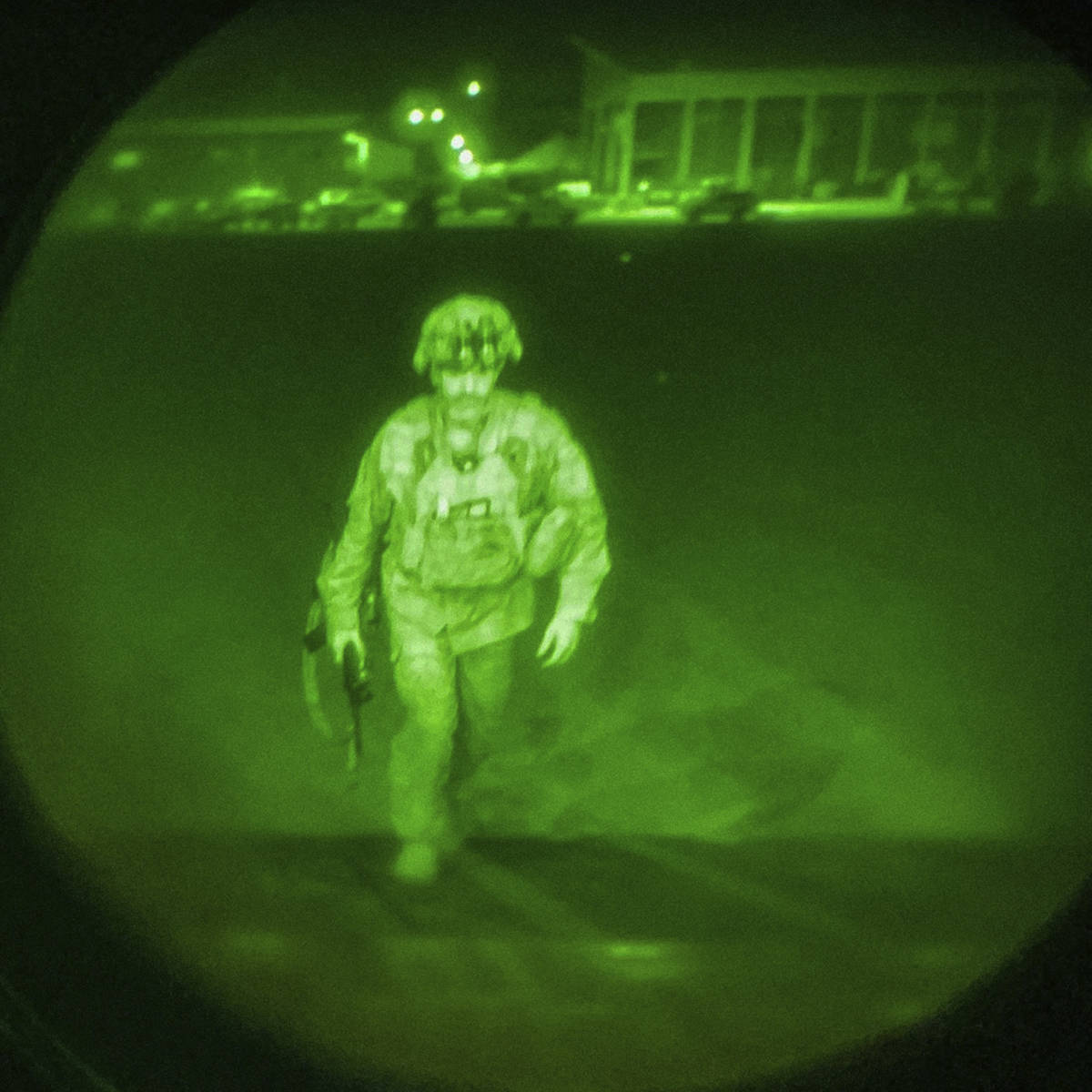 In this image made through a night vision scope and provided by the U.S. Army, Maj. Gen. Chris ...