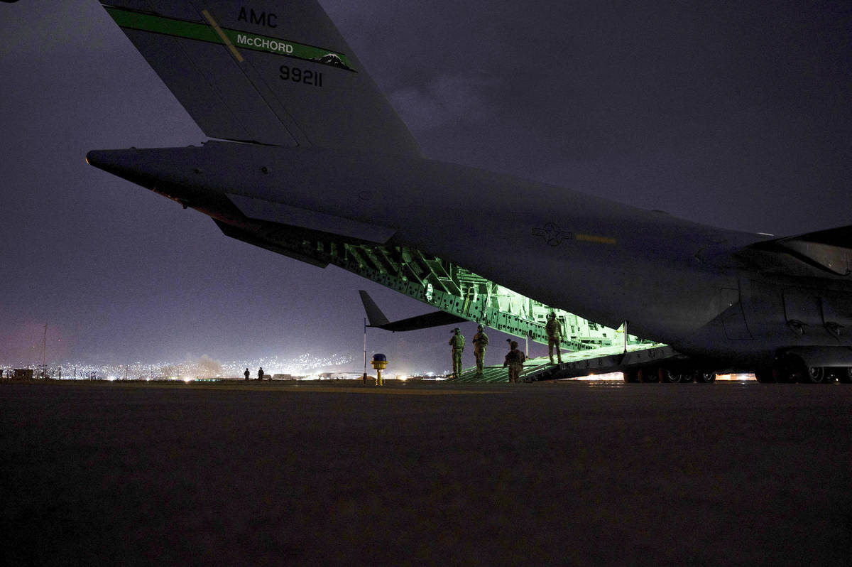 In this Aug. 30, 2021, photo provided by the U.S. Air Force, a Air Force aircrew, assigned to t ...