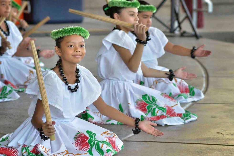 Zaydee Eras, 9, of Las Vegas, left, performs with Halau Hula 'O Kaleimomi during the 28th Annua ...