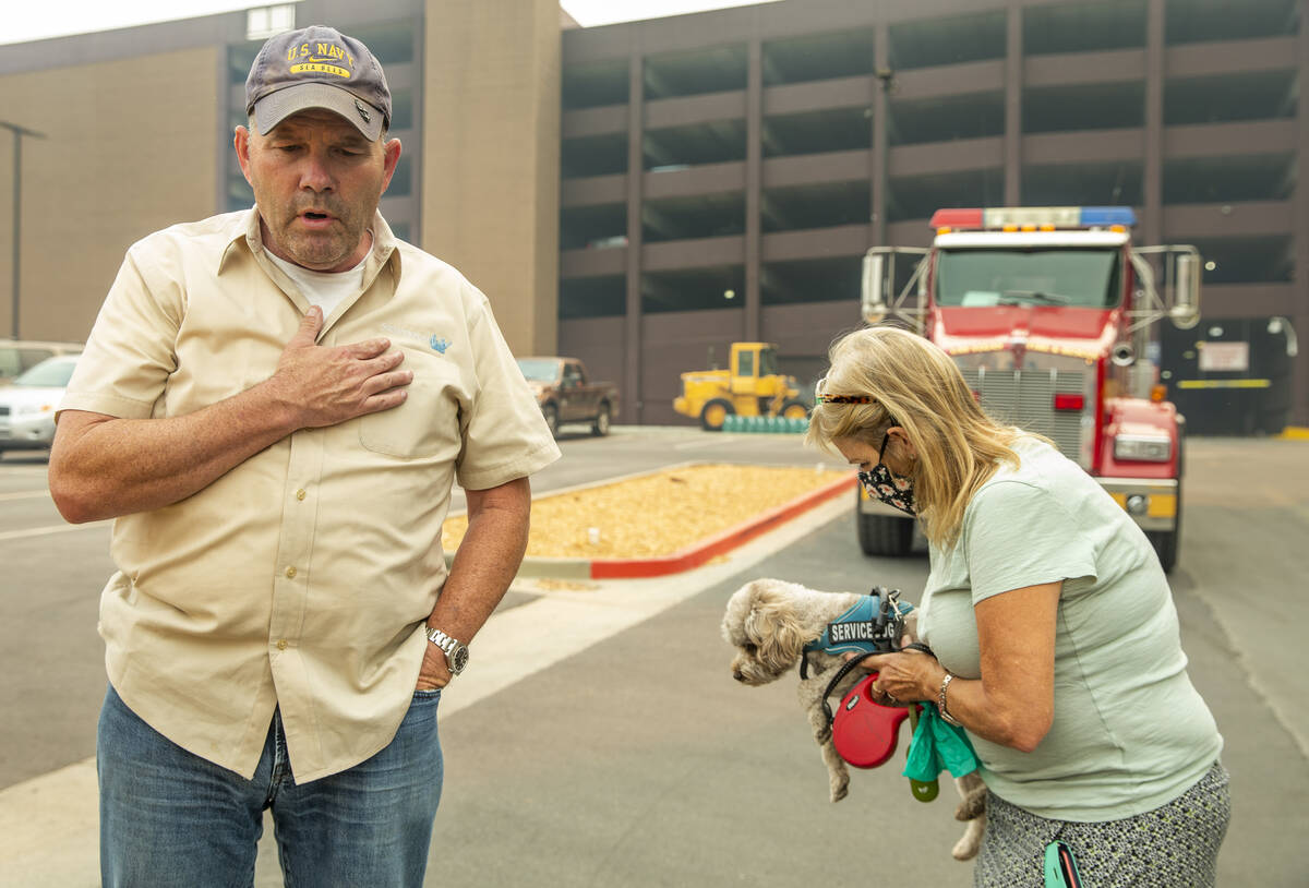 Jim, left, and Alicia Halloran with dog Billy Budd prepare to leave from the MontBleu now evacu ...