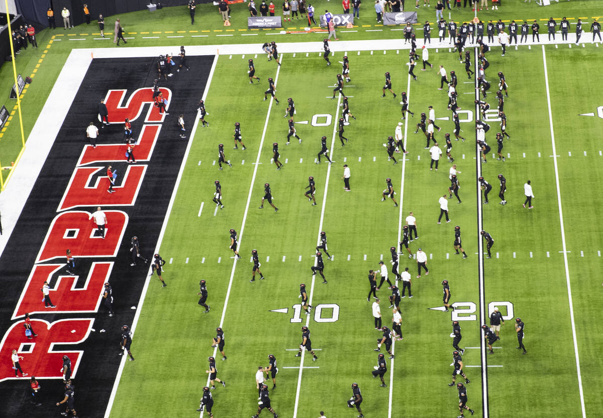 UNLV Rebels players warm up before an NCAA football game against Eastern Washington University ...
