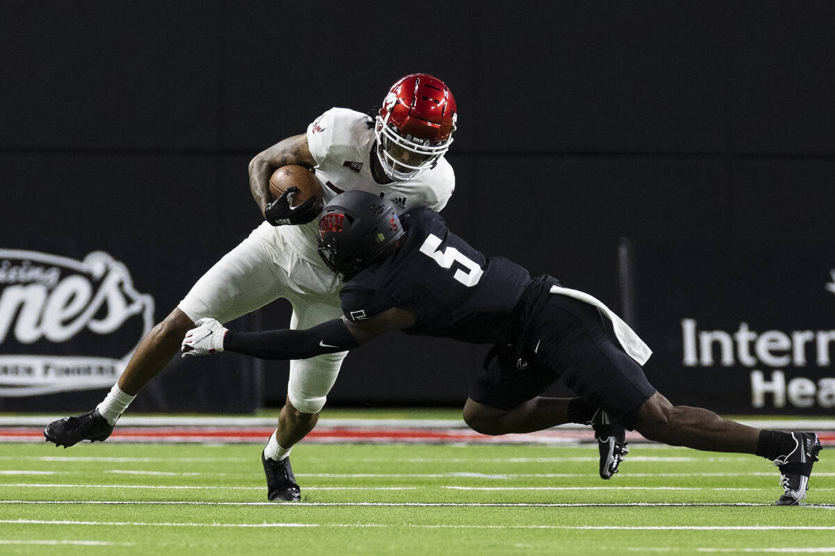 UNLV Rebels defensive back Phillip Hill (5) tackles Eastern Washington UniversityÕs wide r ...