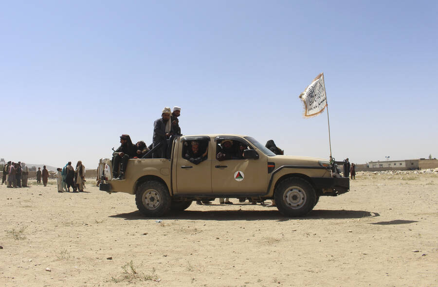 Taliban fighters patrol inside the city of Ghazni, southwest of Kabul, Afghanistan, Friday, Aug ...