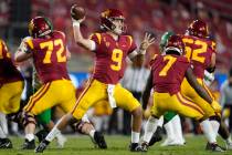 In this Dec 18, 2020, file photo, Southern California quarterback Kedon Slovis (9) throws a pas ...