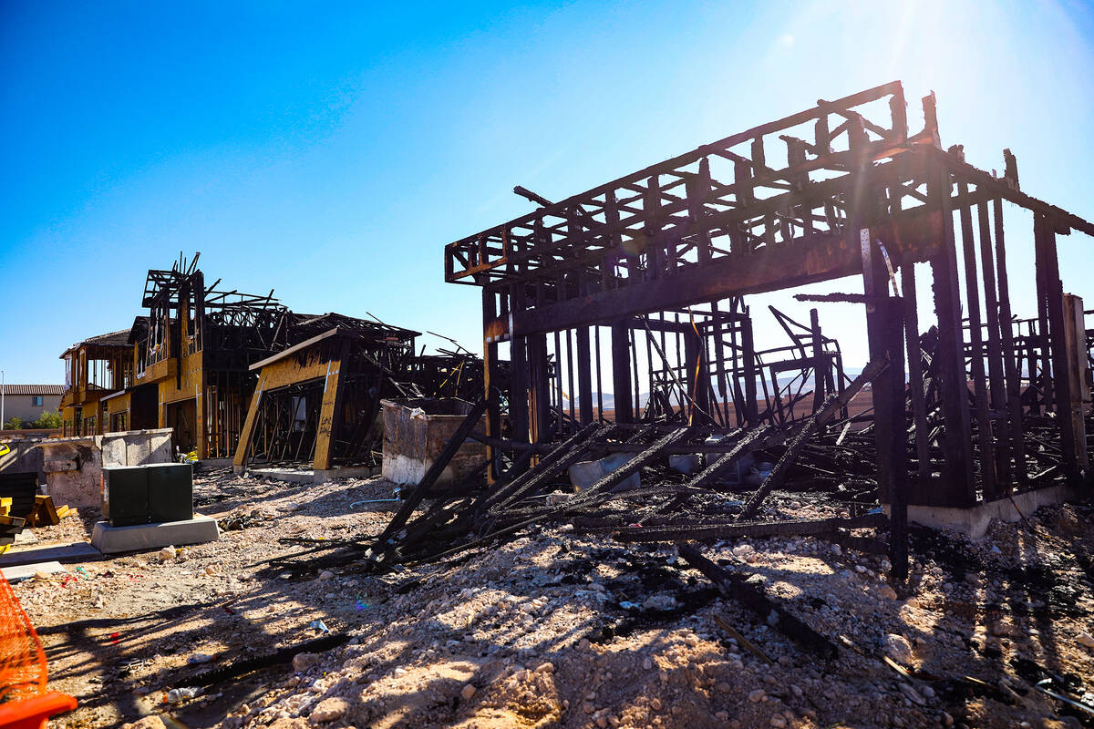 Remnants of a fire from last night at homes under construction by the company KB Home in southw ...
