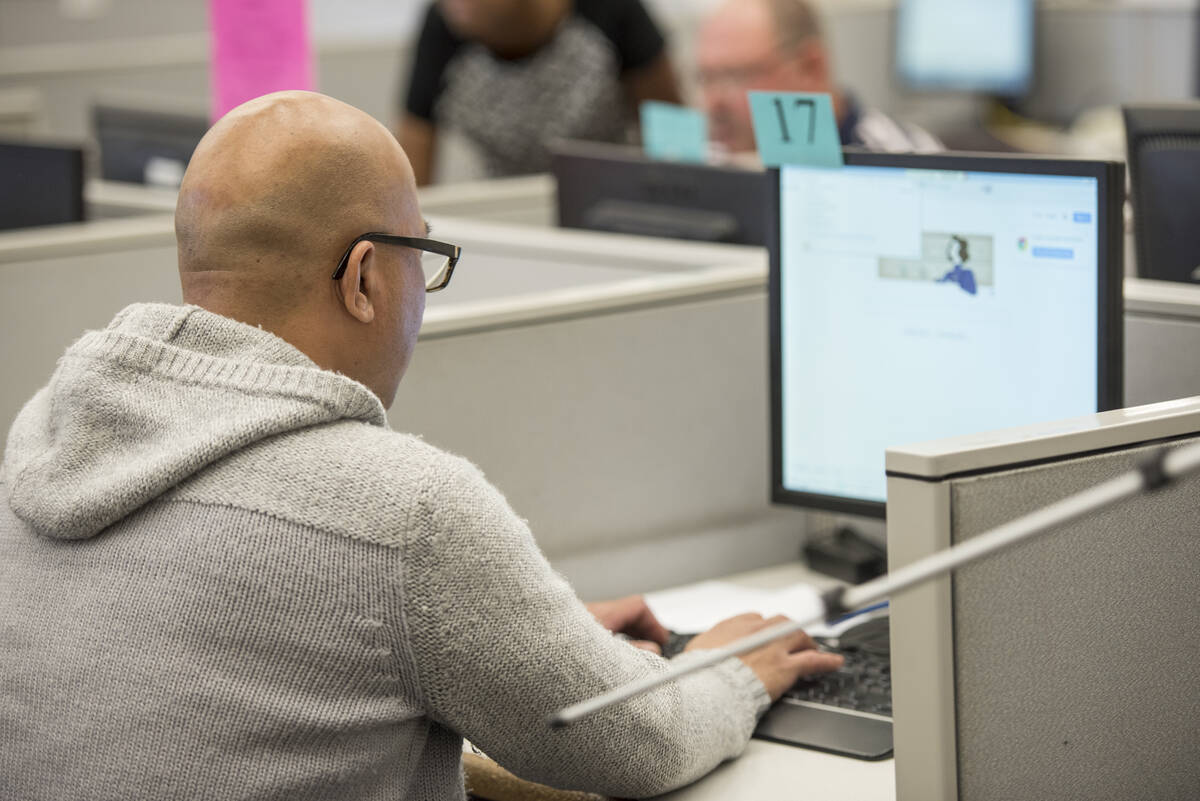 Shaun Lertswan, 40, searches for jobs on a computer at the Nevada JobConnect Center in Las Vega ...