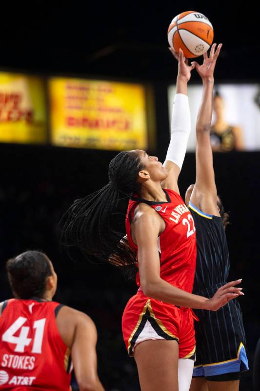 Las Vegas Aces forward A'ja Wilson (22) jumps for the ball with Chicago Sky forward/center Azur ...
