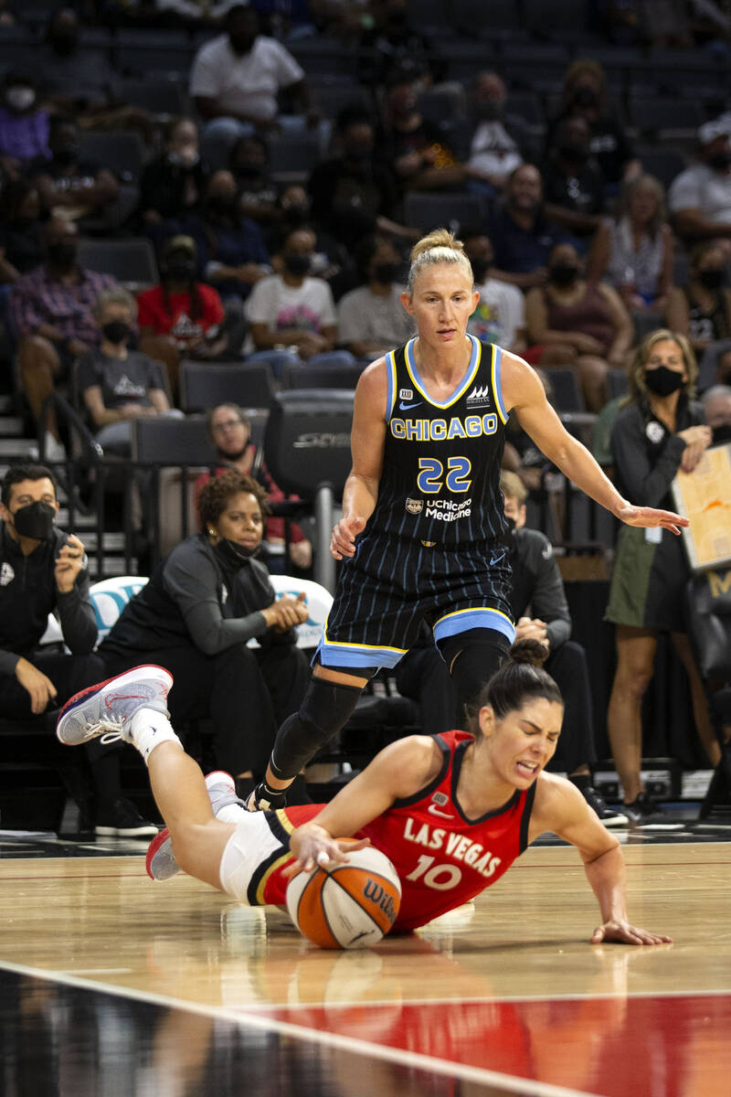 Las Vegas Aces guard Kelsey Plum (10) hits the ground as Chicago Sky guard Courtney Vandersloot ...