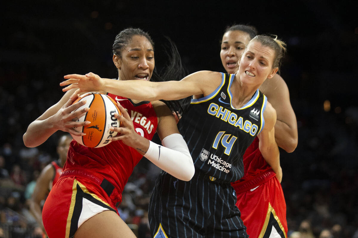 Las Vegas Aces forward A'ja Wilson (22) fights for control of the ball with Chicago Sky guard A ...