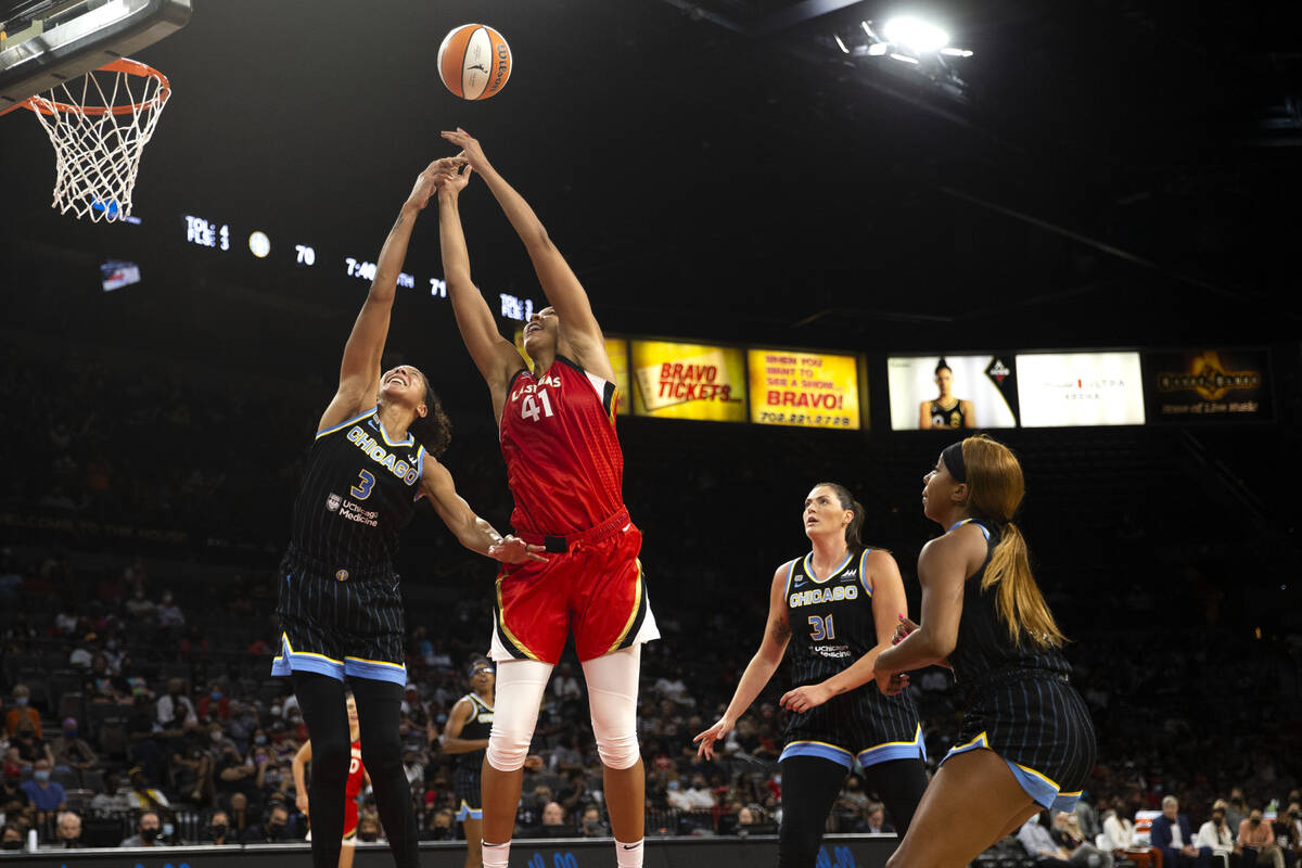 Chicago Sky forward/center Candace Parker (3) and Las Vegas Aces center Kiah Stokes (41) jump f ...