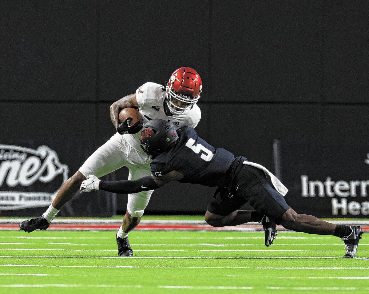 UNLV Rebels defensive back Phillip Hill (5) tackles Eastern Washington UniversityÕs wide r ...