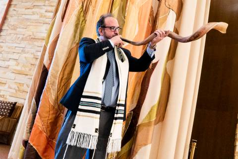 In a 2018 photo, Rabbi Sanford Akselrad of Congregation Ner Tamid sounds the shofar, which is u ...