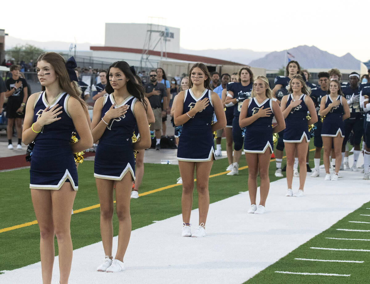 Foothill HighÕs cheerleaders place their right hand over their heart during the National A ...