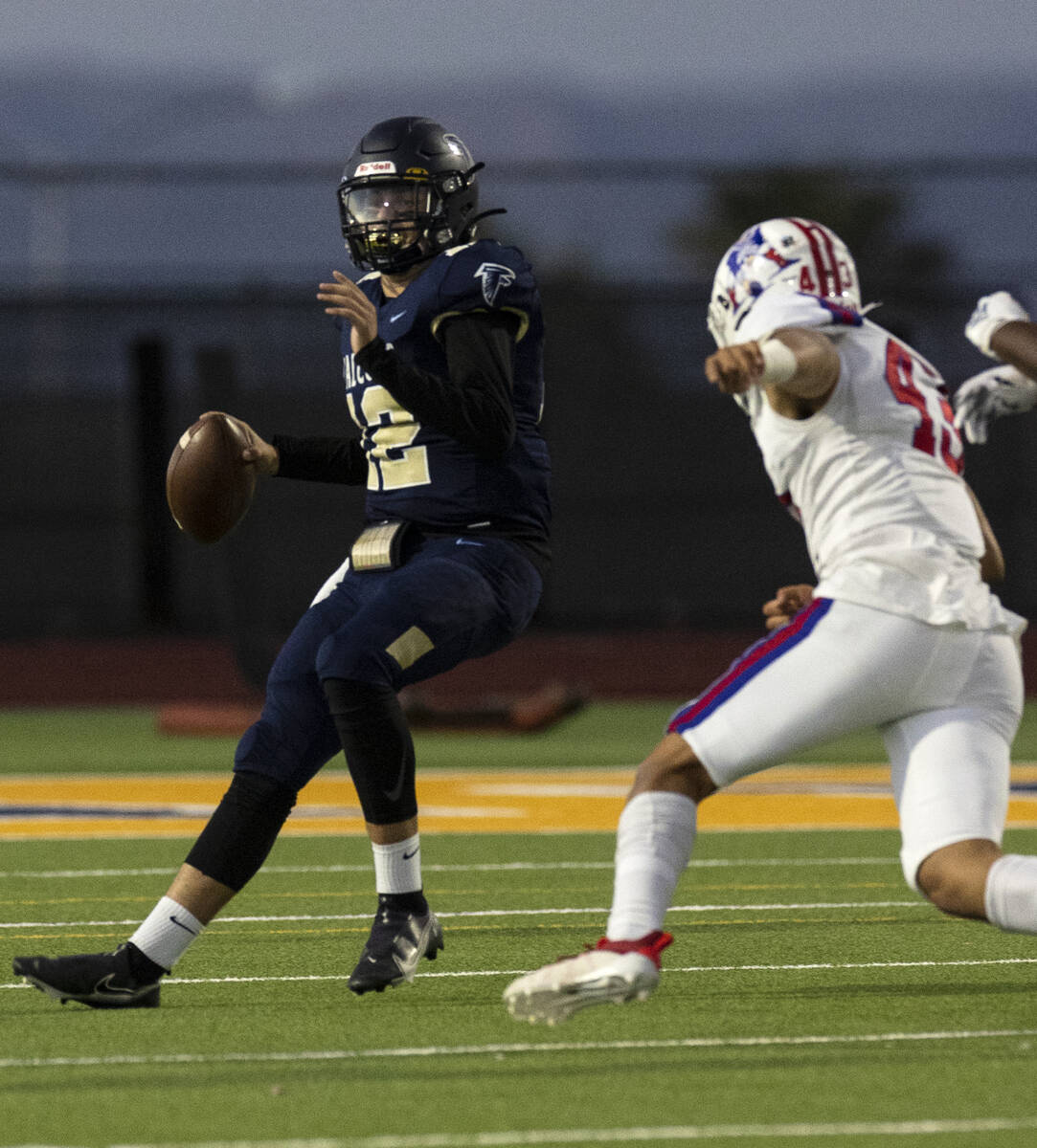 Foothill HighÕs quarterback Cameron Paul (12) prepares to throw a pass as Liberty High ...