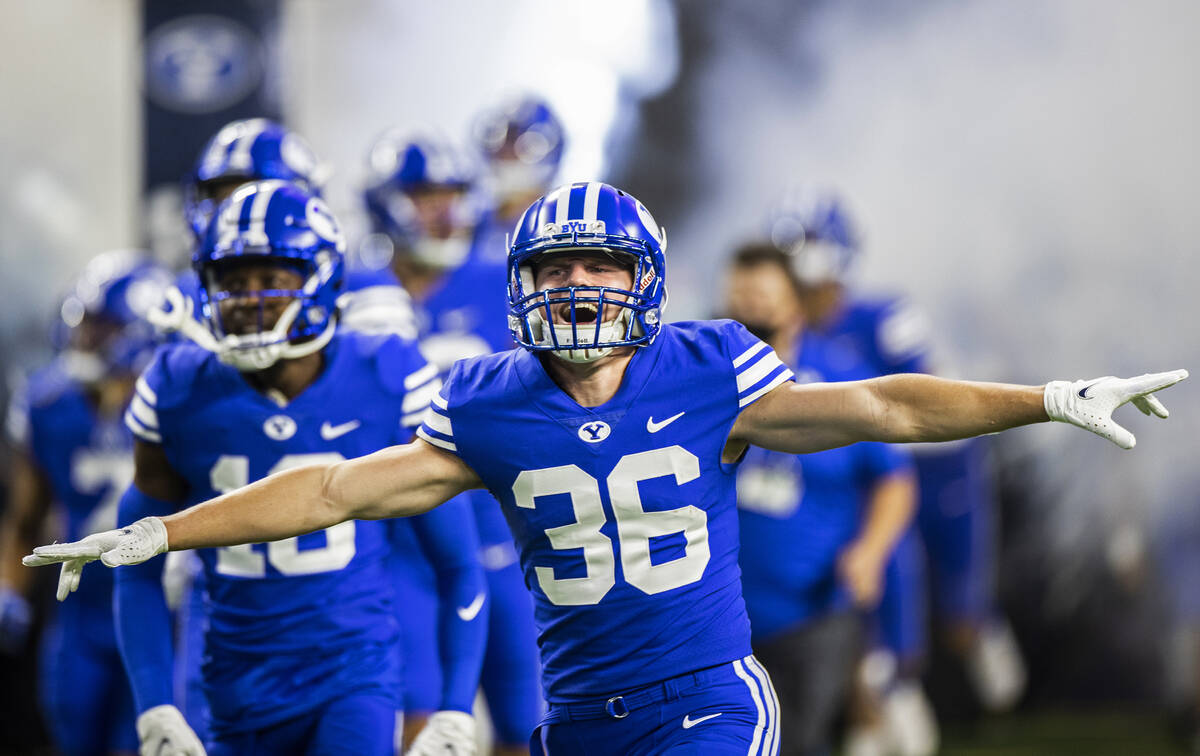 Brigham Young Cougars linebacker Cade Hoke (36) takes the field with his teammates before the s ...