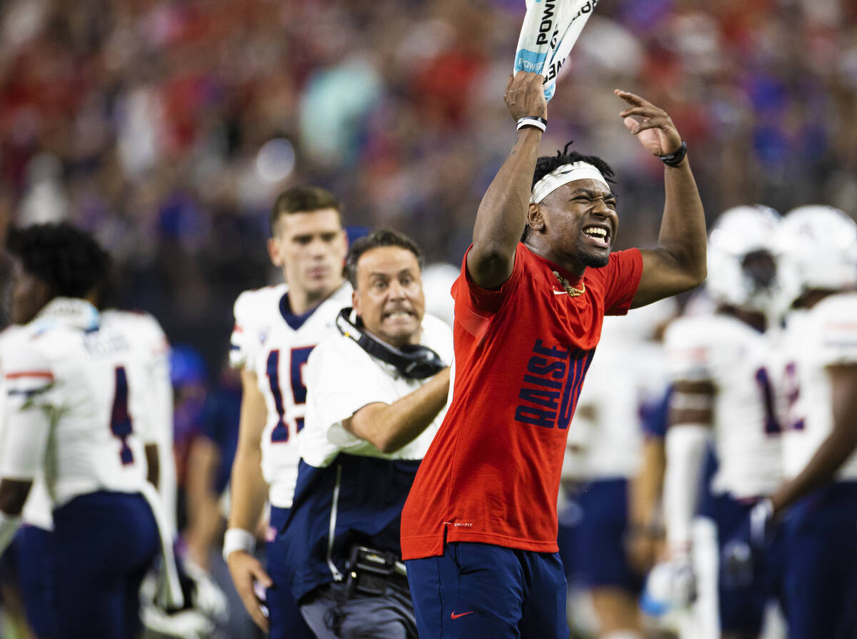 Arizona Wildcats players try and fire up their team in the fourth quarter during a college foot ...