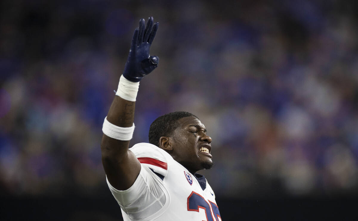 Arizona Wildcats linebacker Rashie Hodge Jr. (35) tries to fire up his team in the fourth quart ...