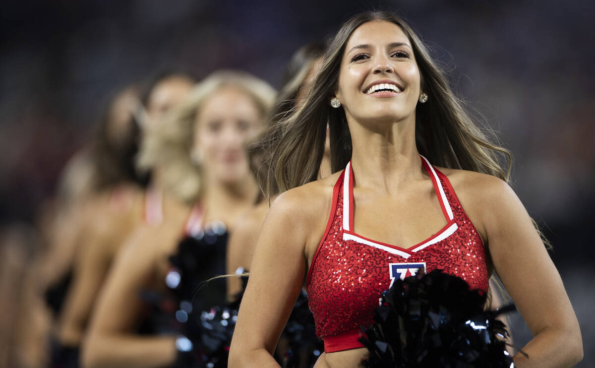 Arizona Wildcat cheerleaders perform in the first quarter during a college football game agains ...