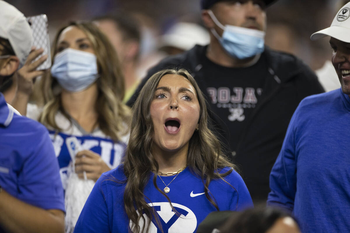 BYU fans cheer for the Cougars in the first quarter during a college football game against the ...