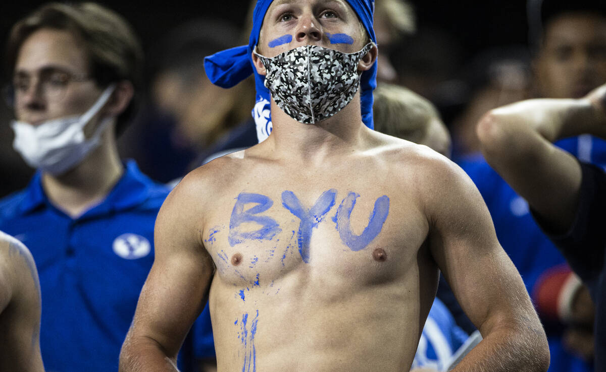 BYU fans cheer for the Cougars in the first quarter during a college football game against the ...