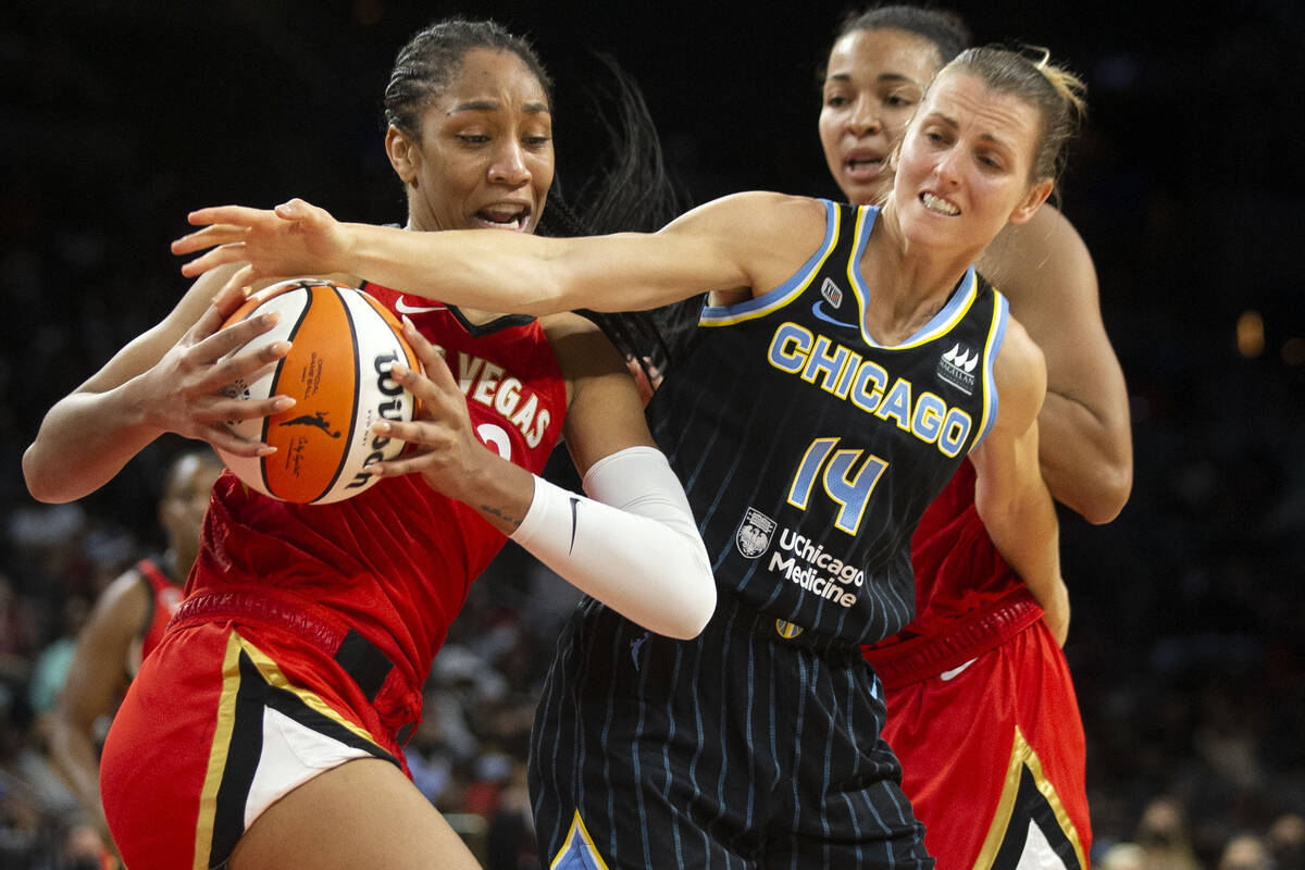 Las Vegas Aces forward A'ja Wilson (22) fights for control of the ball with Chicago Sky guard A ...