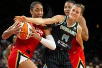 Las Vegas Aces forward A'ja Wilson (22) fights for control of the ball with Chicago Sky guard A ...