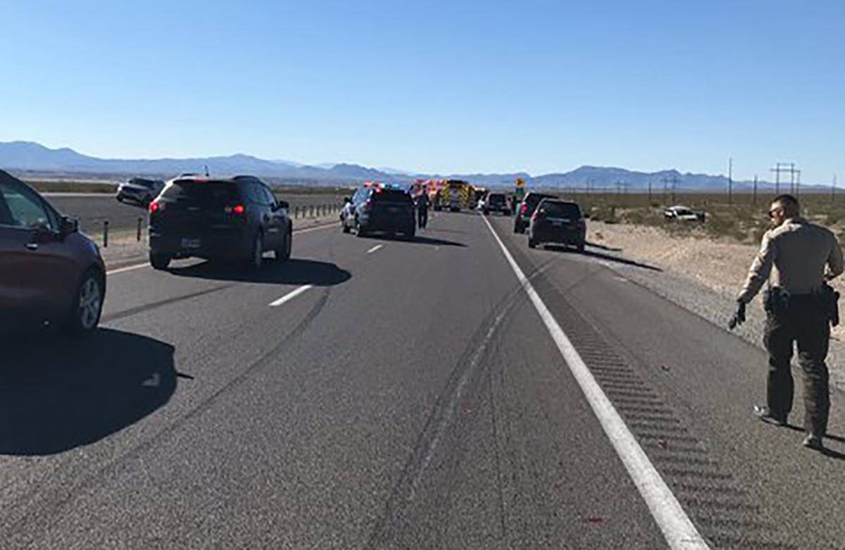 Law enforcement officers investigate a fatal two-vehicle crash on State Route 160 near Pahrump ...
