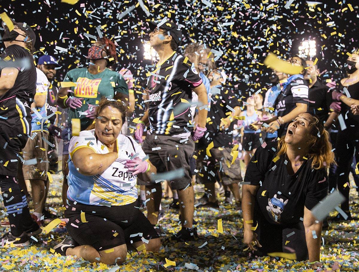 People scramble for money during the annual “$5,000 Cash Drop presented by Jarritos&#x20 ...