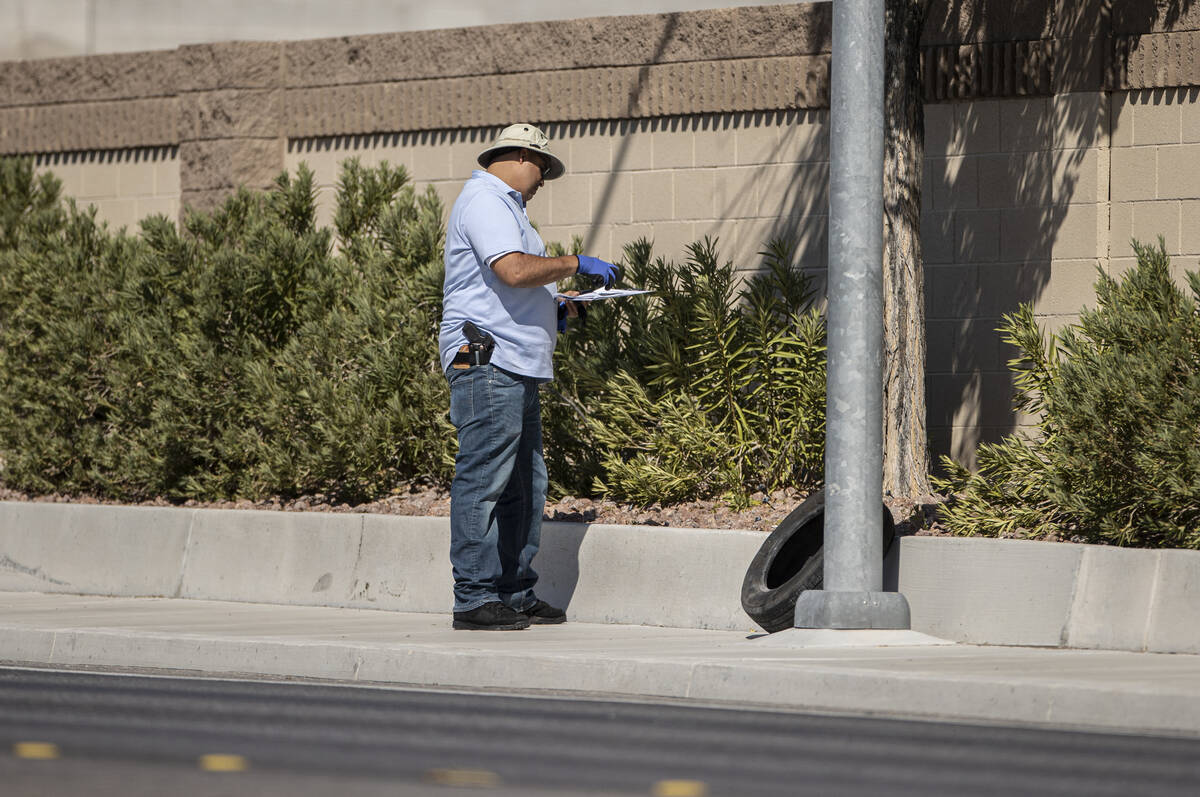 Law enforcement investigates a fatal car crash near North Tenaya Way and Farm Road on Monday, S ...