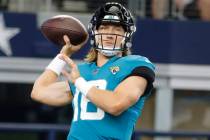 Jacksonville Jaguars quarterback Trevor Lawrence (16) throws the ball prior to playing the Dall ...