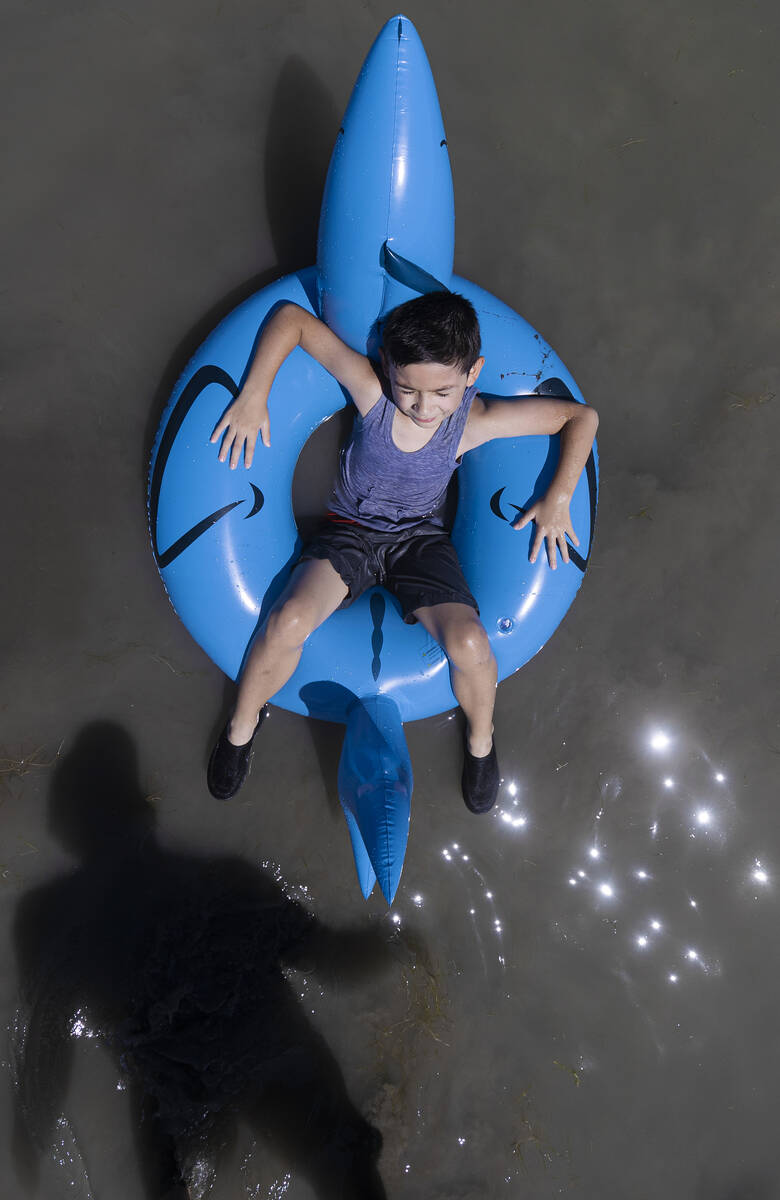 Mason Soto, 6, enjoys playing in Lake Mead on Labor Day on Monday, Sept. 6, 2021, in Boulder Ci ...