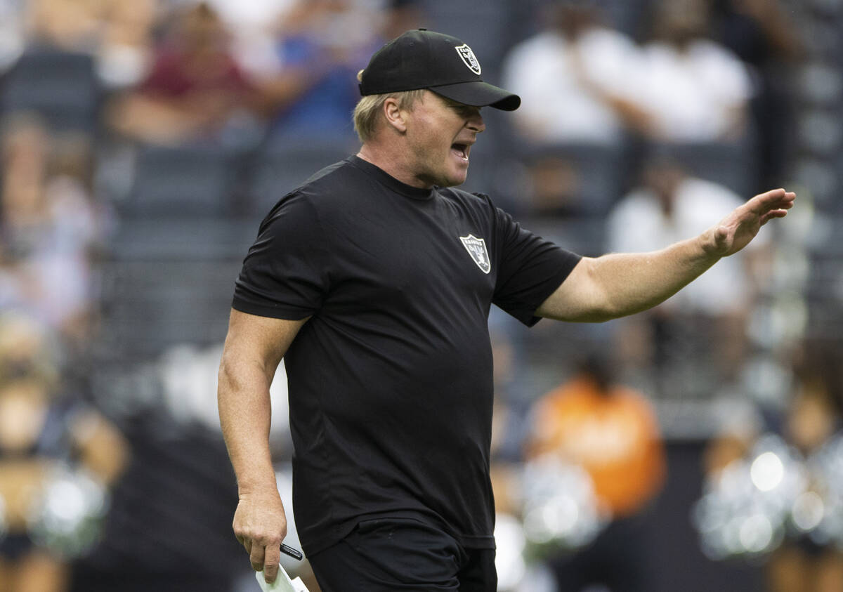 Raiders head coach Jon Gruden calls a play during a special training camp practice for season t ...