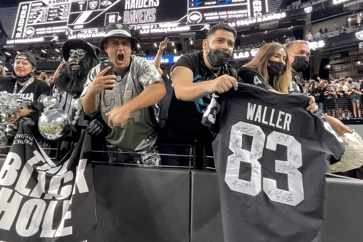 Fans cheer the Raiders at the end of a home opening pre-season NFL football game versus the Sea ...