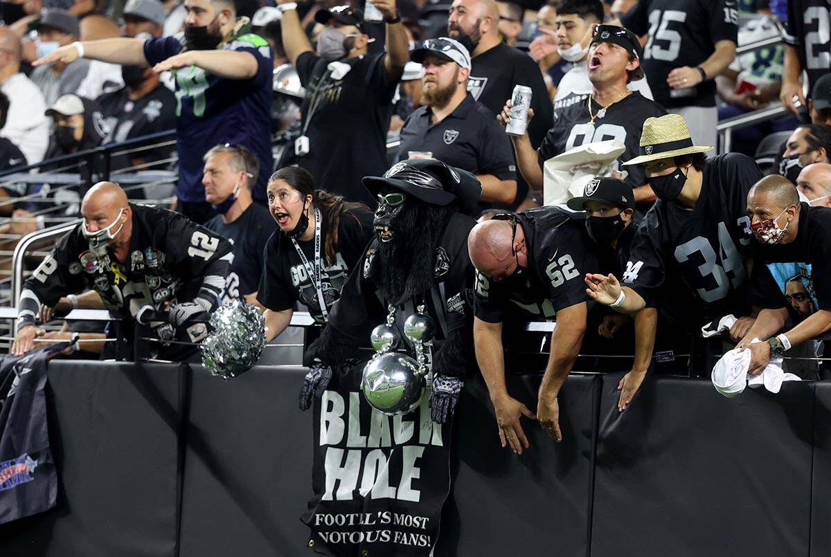 Fans in the Black Hole cheer during the third quarter of the Raiders home opening pre-season NF ...