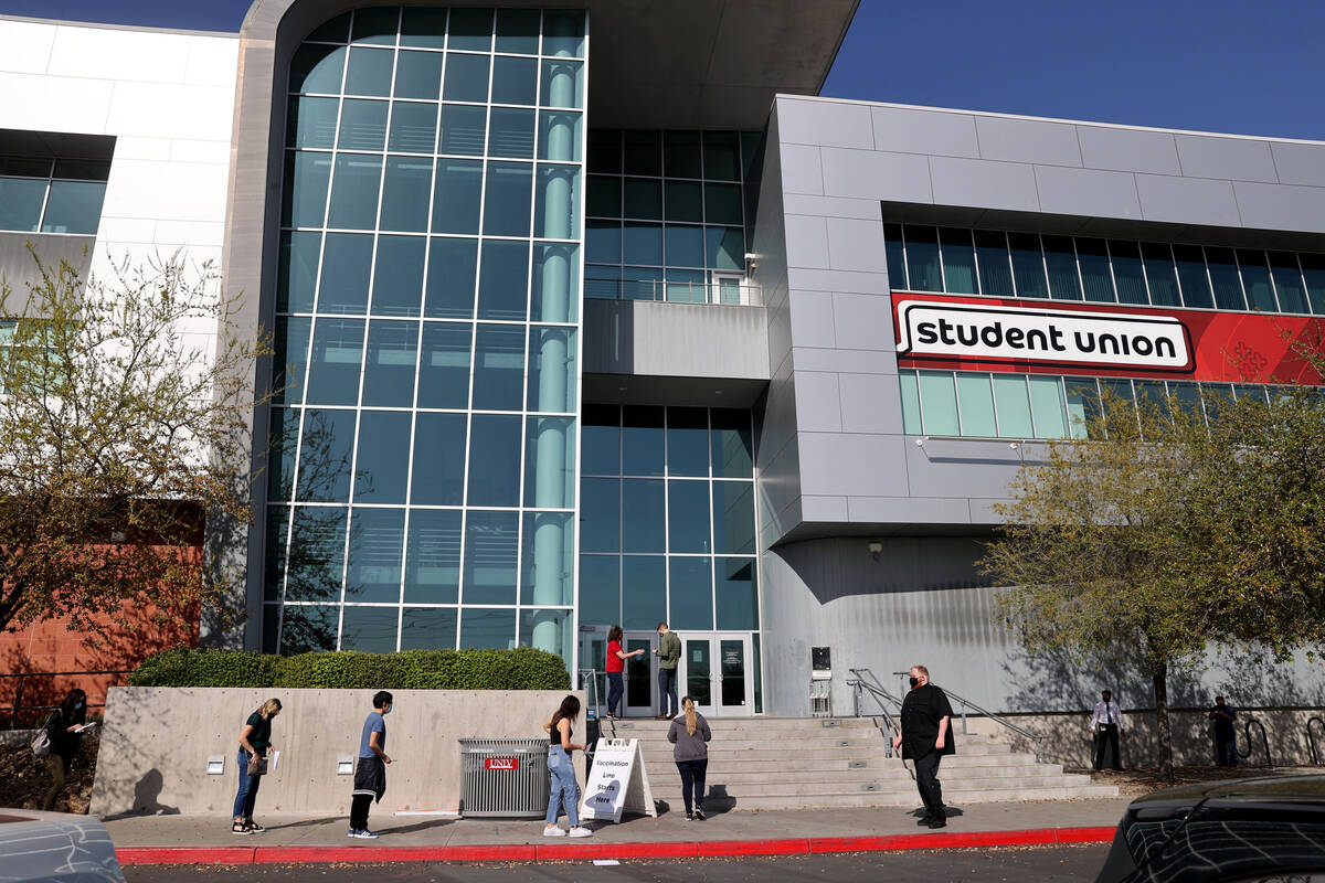 People line up at the UNLV vaccination site Monday, April 5, 2021. Nevada’s higher education ...