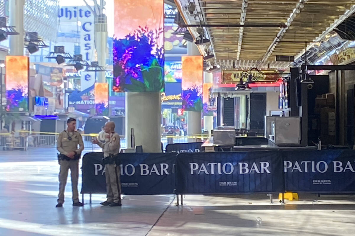 Las Vegas police investigate a shooting outside the Four Queens in downtown Las Vegas on Wednes ...