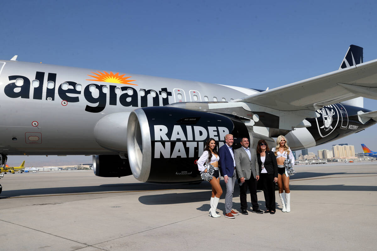 Las Vegas Raiderette Kristina, from left, Scott DeAngelo, Allegiant's executive vice president ...