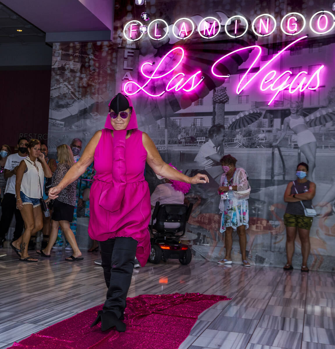 Joni Snellgrove of Dillingham, Alaska, takes stroll amongst attendees during a costume contest ...