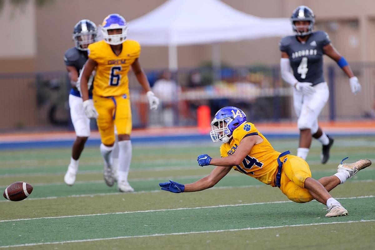 Orem's Kolton Brown (14) dives short of the ball in the second quarter of a football game again ...