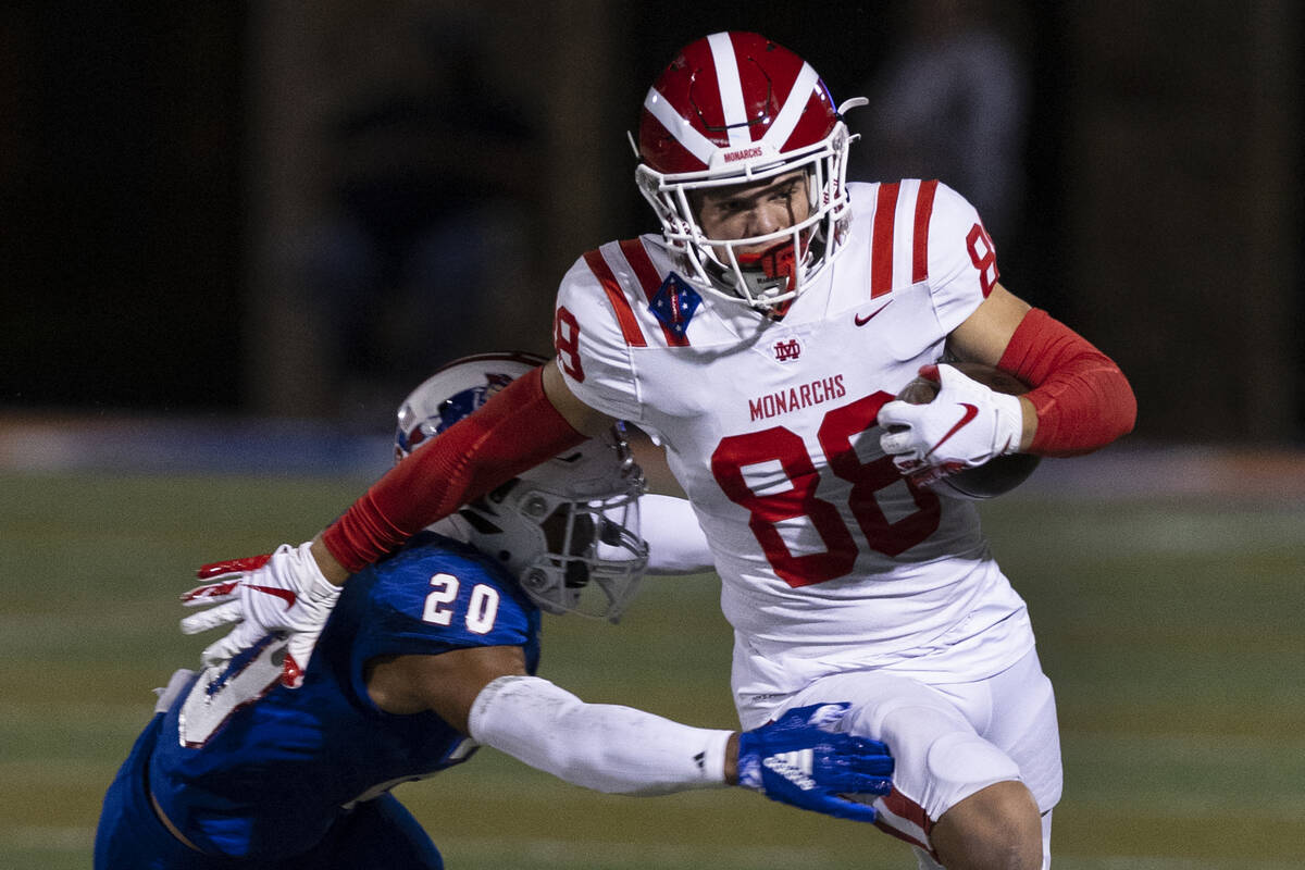 Liberty High safety Saco Alofipo (20) tries to take down Mater Dei High wide receiver Jack Ress ...