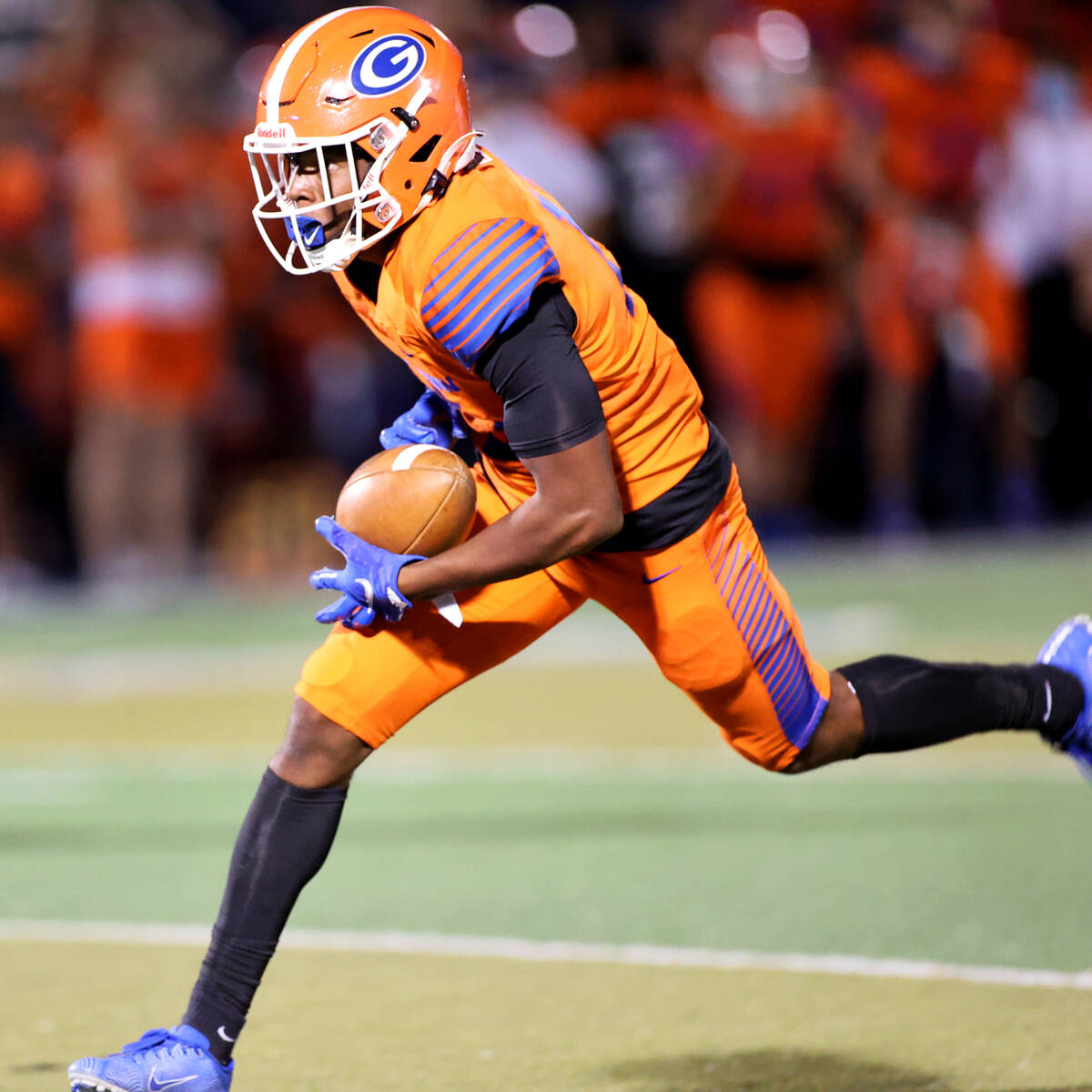 Bishop Gorman's Jeremiah Hughes (13) makes a catch for a touchdown in the first quarter of a fo ...