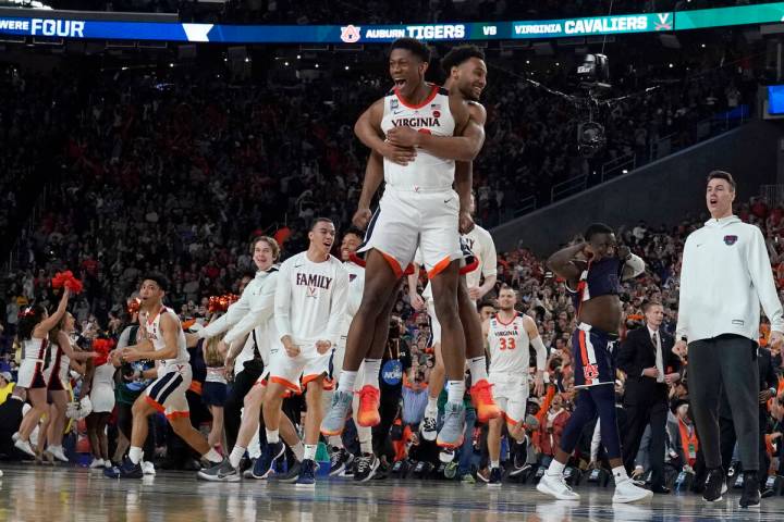 Virginia players celebrate after defeating Auburn 63-62 in the semifinals of the Final Four NCA ...